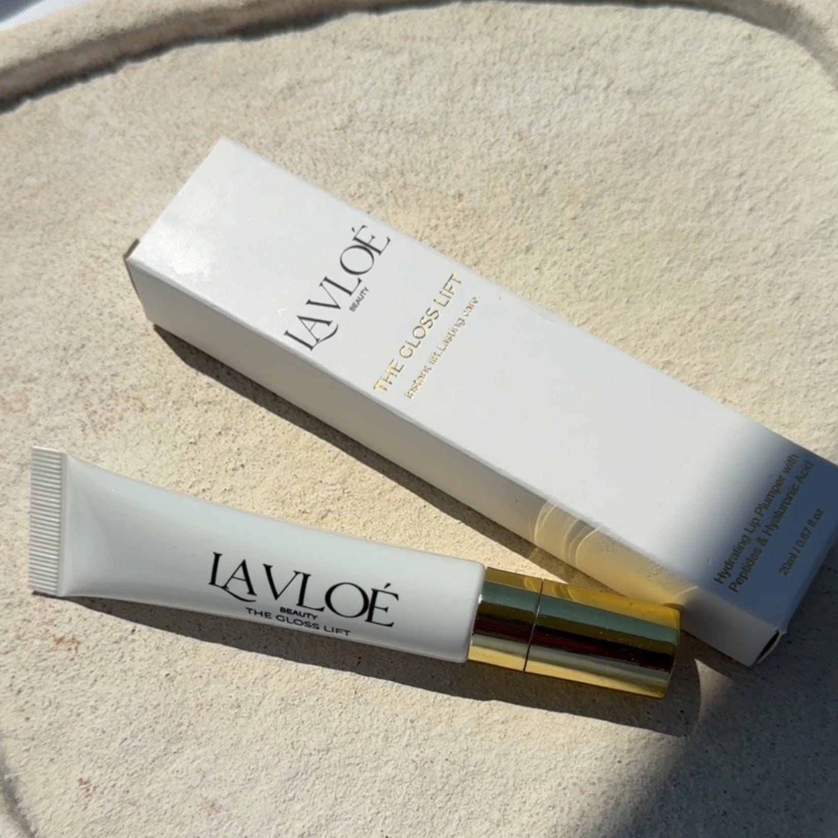 Lavloe skincare product packaging on a textured surface